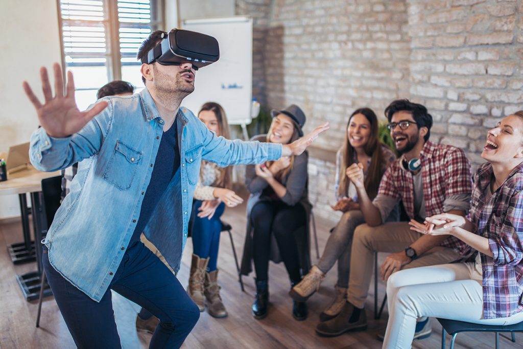 Business team playing with virtual reality equipment