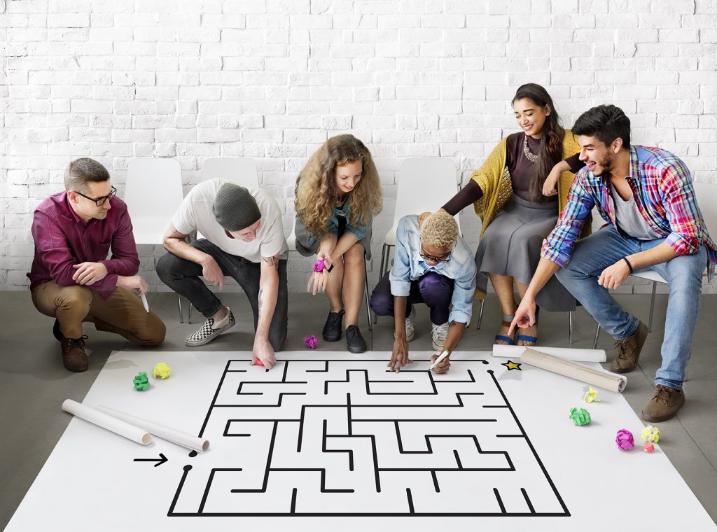 Team solving large maze outline