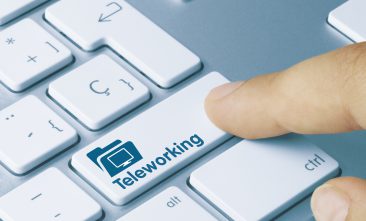 Instead of an "enter" button on their keyboard, this person's key reads "teleworking" as they work from home.