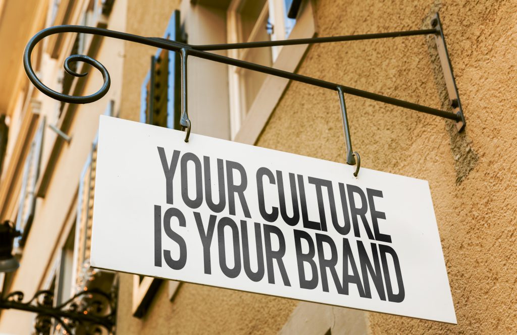 A street sign reads "Your Culture is Your Brand."