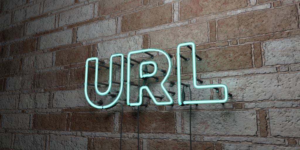 URL - Glowing Neon Sign on stonework wall